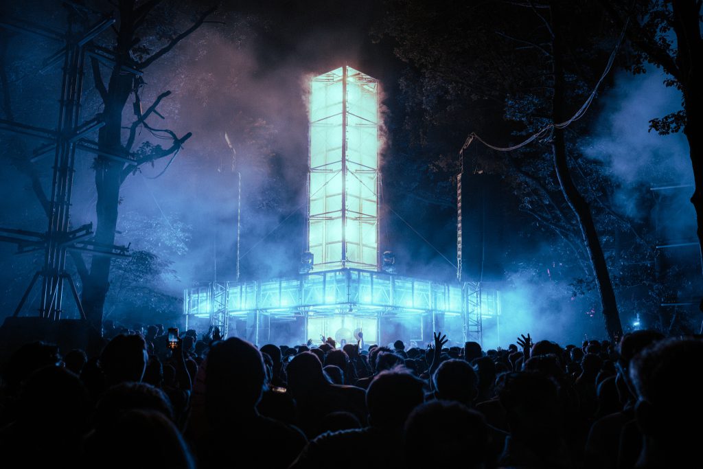 Awakenings Summer Festival 2025 Beekse Bergen, Production People provided light and for area X, Y, A and festival site and sound for area X, A, B. this picture is of outdoor area A, a smokey tower in the forest, by night